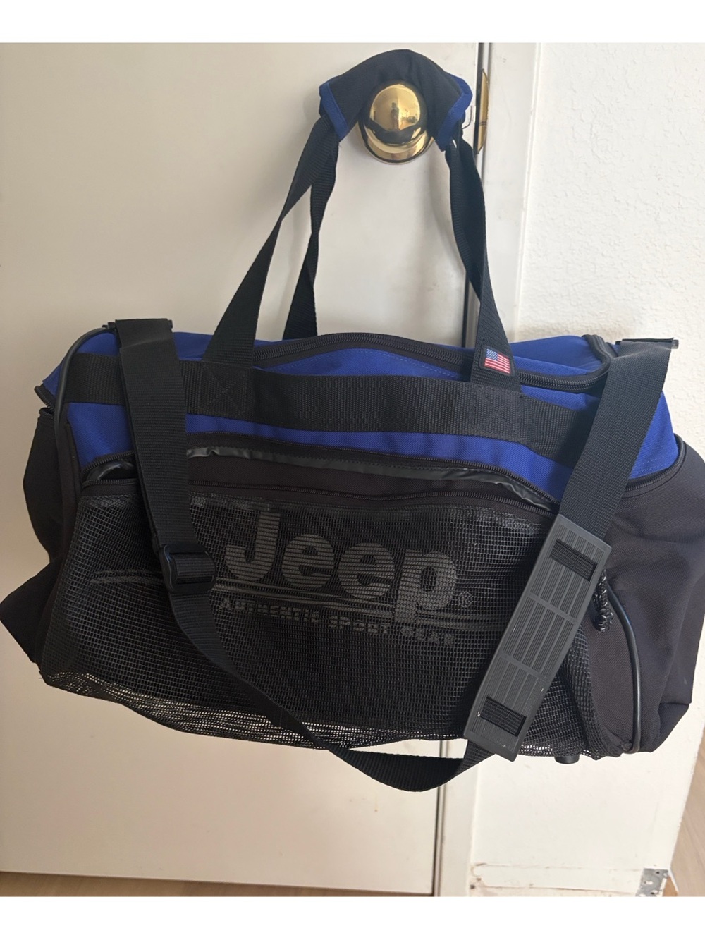 Jeep blue and black duffel bag with front mesh pocket.